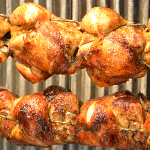 4 roast chickens on a spit