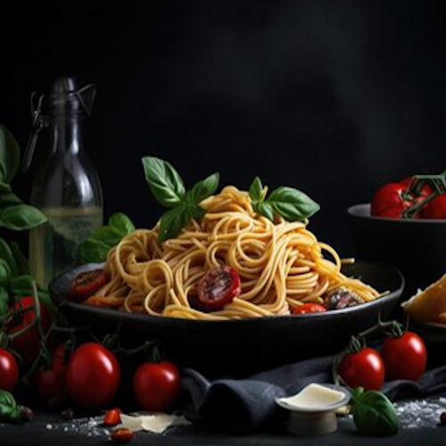 bowl of spaghetti with wine bottle and cherry tomatoes scattered around on a black background