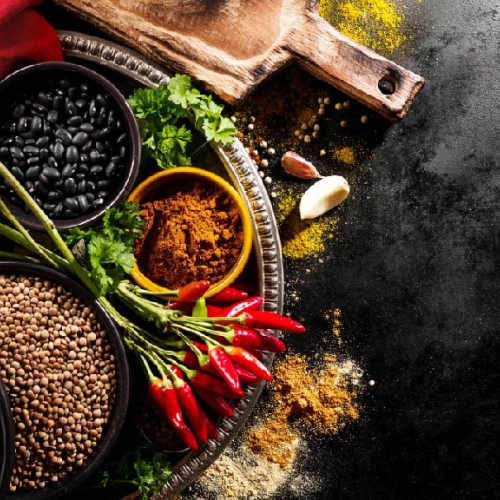 a large plate with spices, chilli and daal.